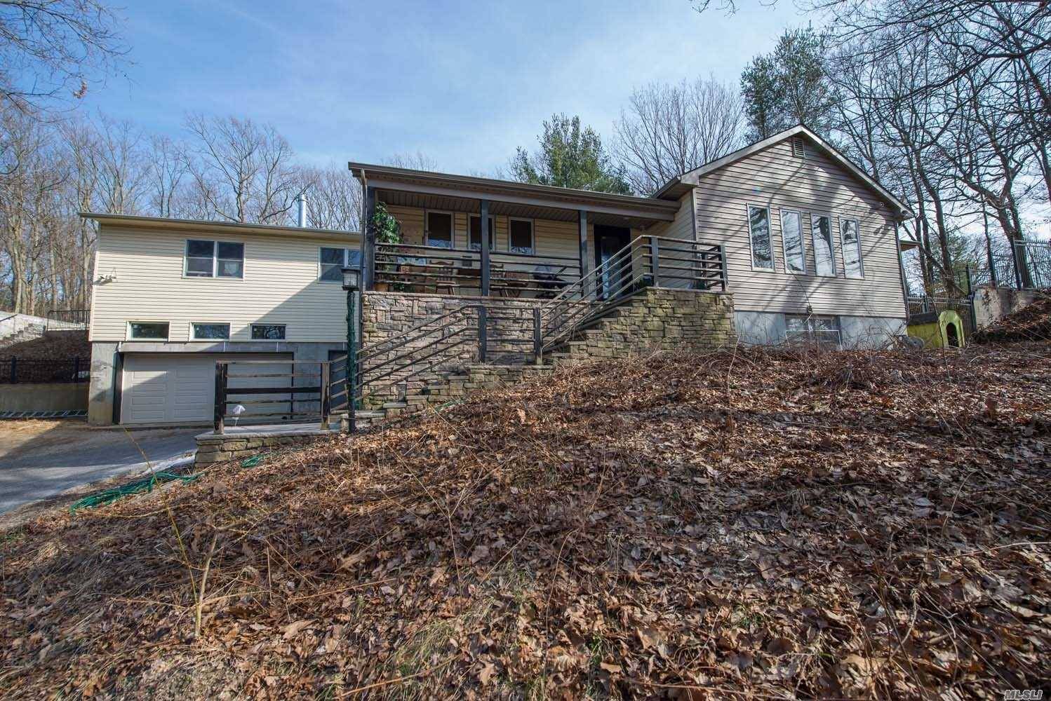 Nestled On Top Of A Secluded Hill, This Rare Expanded Ranch Is Nested On An Acre Of Property.