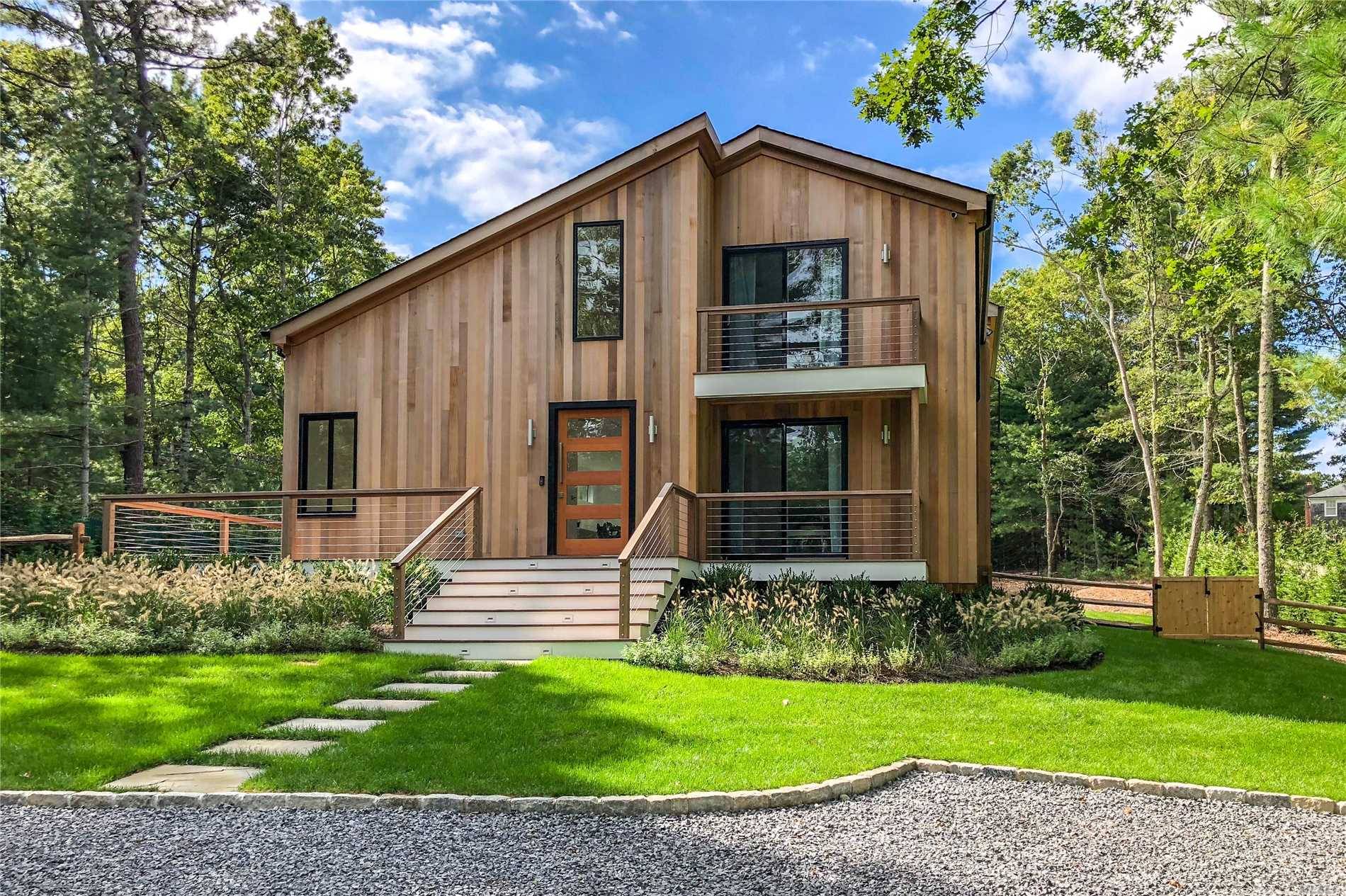 CHIC NEW EAST HAMPTON RENOVATION WITH POOL Enjoy this newly and completely renovated four bedroom four bath home on two acres.