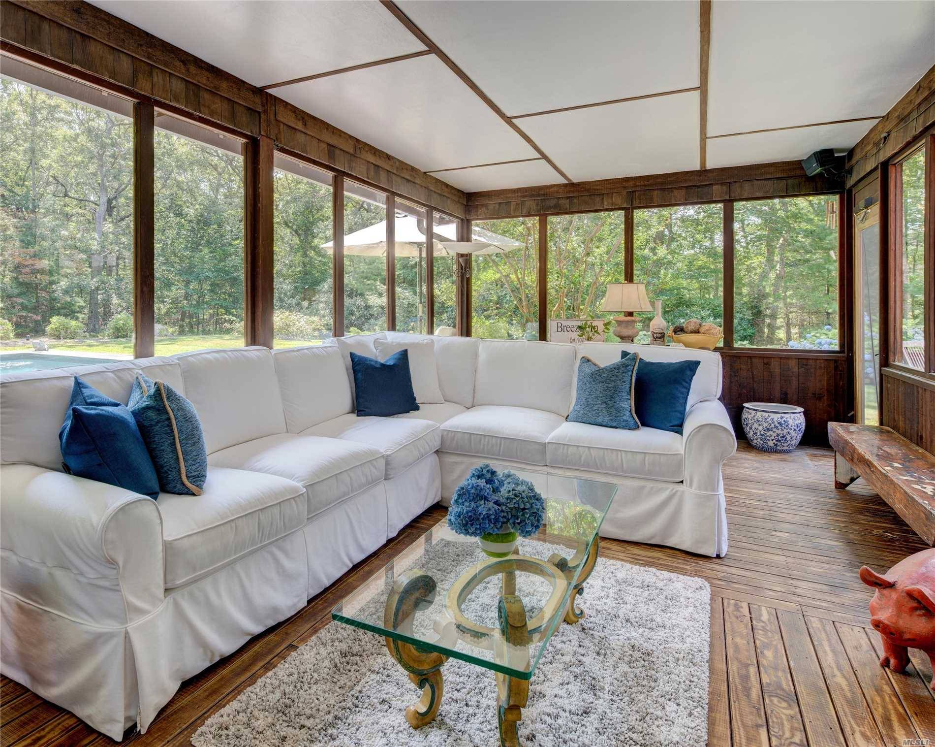 EAST HAMPTON HOME WITH POOL FOR SALE Warm and inviting three bedroom, two and one half bath, situated on a beautifully landscaped 1 acre with a sparkling pool.