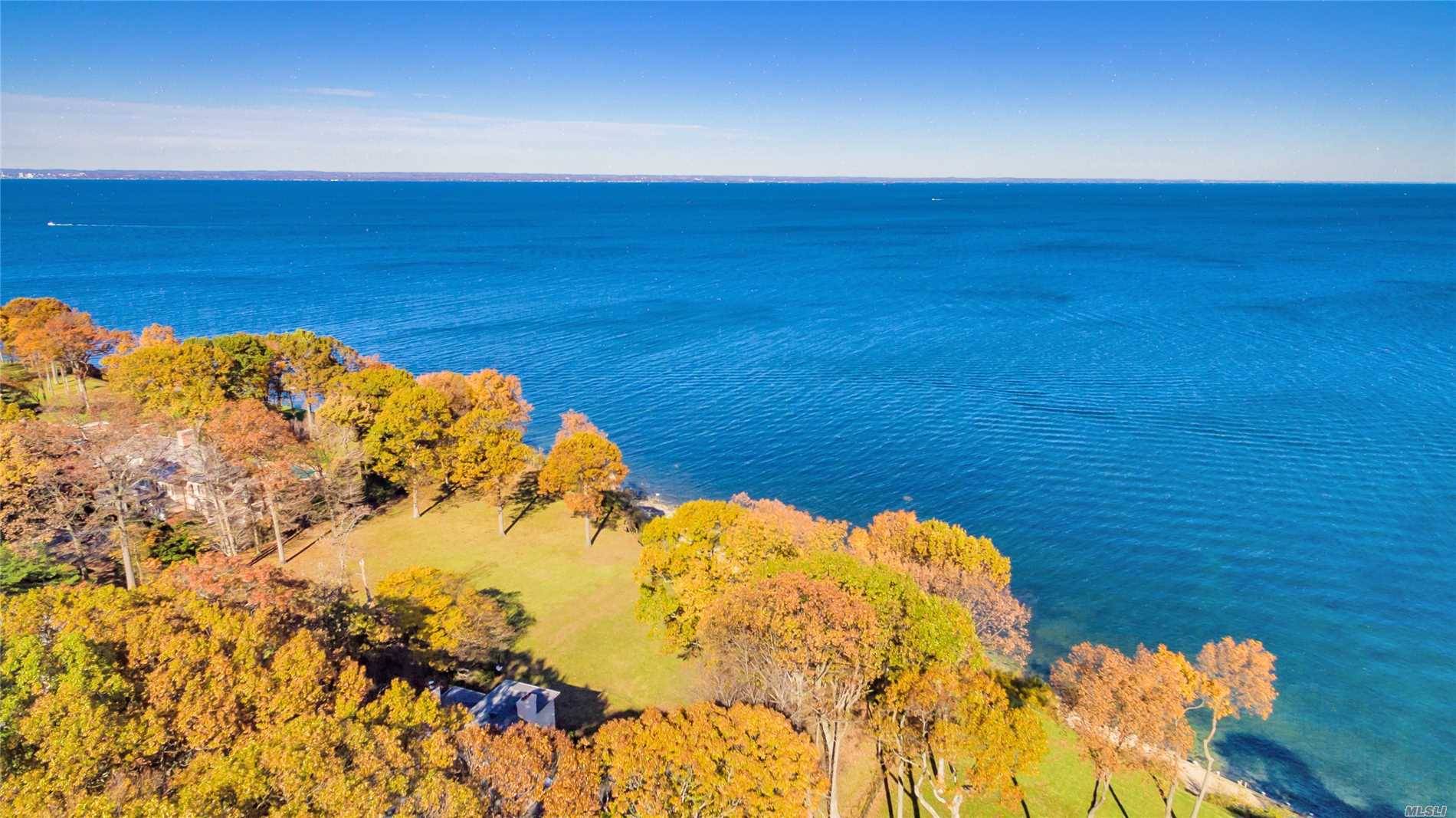 Waterfront Home Nestled On 2 Acres With 180 Degree Captivating WaterViews Of The Long Island Sound.