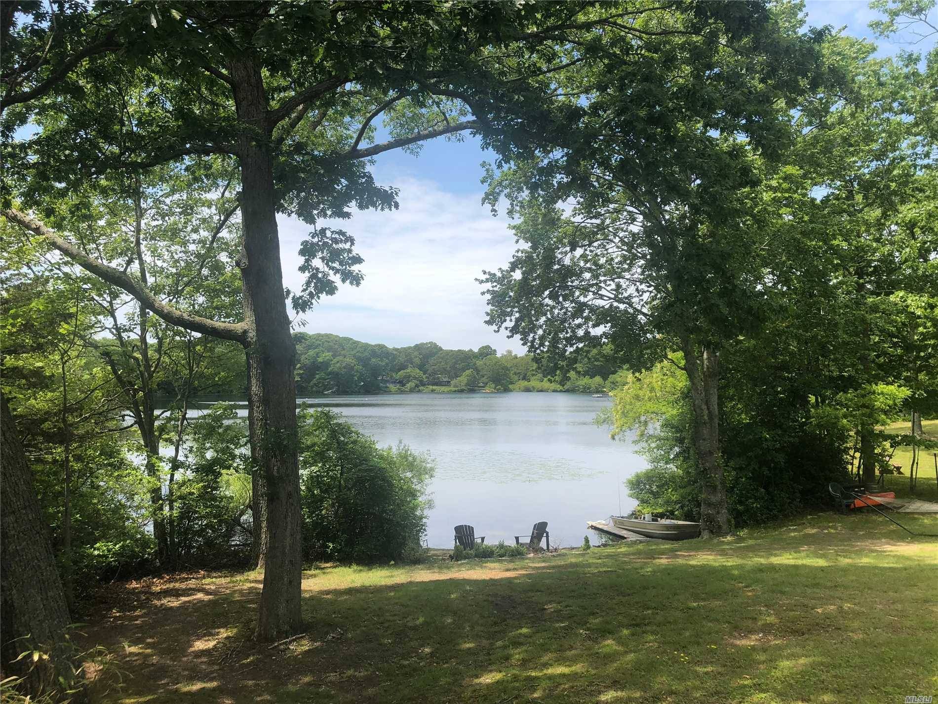 Enjoy stunning waterfront sunsets, surrounded by nature, from this quaint 2BR, 1BA cottage on Shelter Island's lake, known as Fresh Pond.