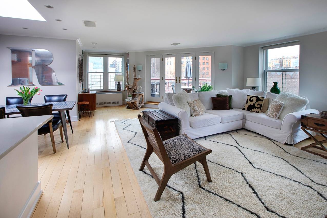 This spacious, sun filled three bedroom apartment is on the top floor of a meticulously kept boutique condo located in one of Manhattan's most coveted neighborhoods.
