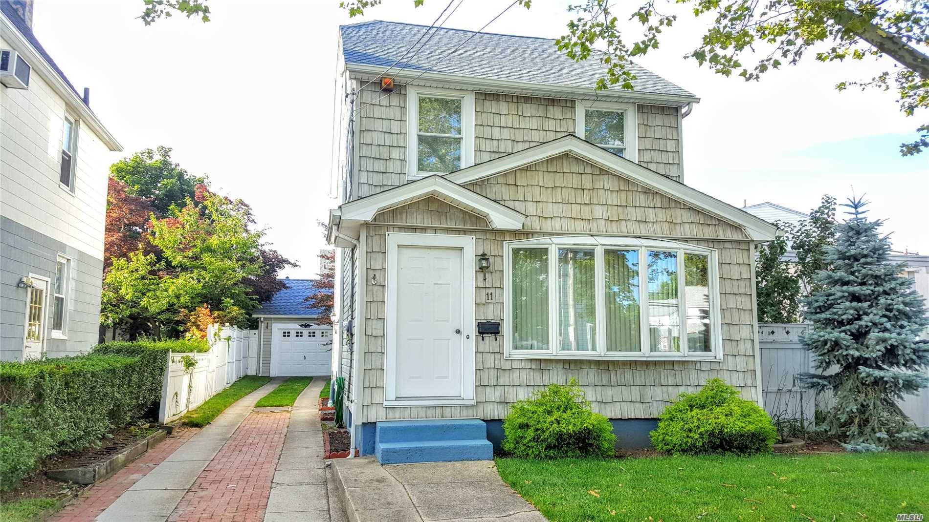Beautifully maintained colonial in awarded Herricks SD 9 boasts a wrap around deck and french doors that open up to the yard.