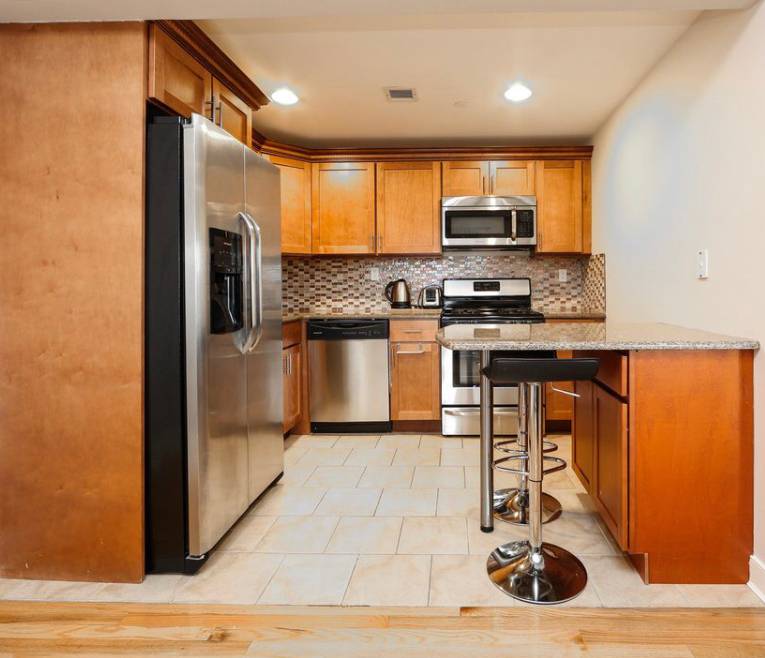 Entirely Renovated Condo Boasting Custom Designed Kitchen and Bathroom Entails Central A C, Oversized Closets, Custom Window Treatments, Washer Dryer, Glittering Hardwood Floors, Open Custom Made Kitchen, New Top of ...