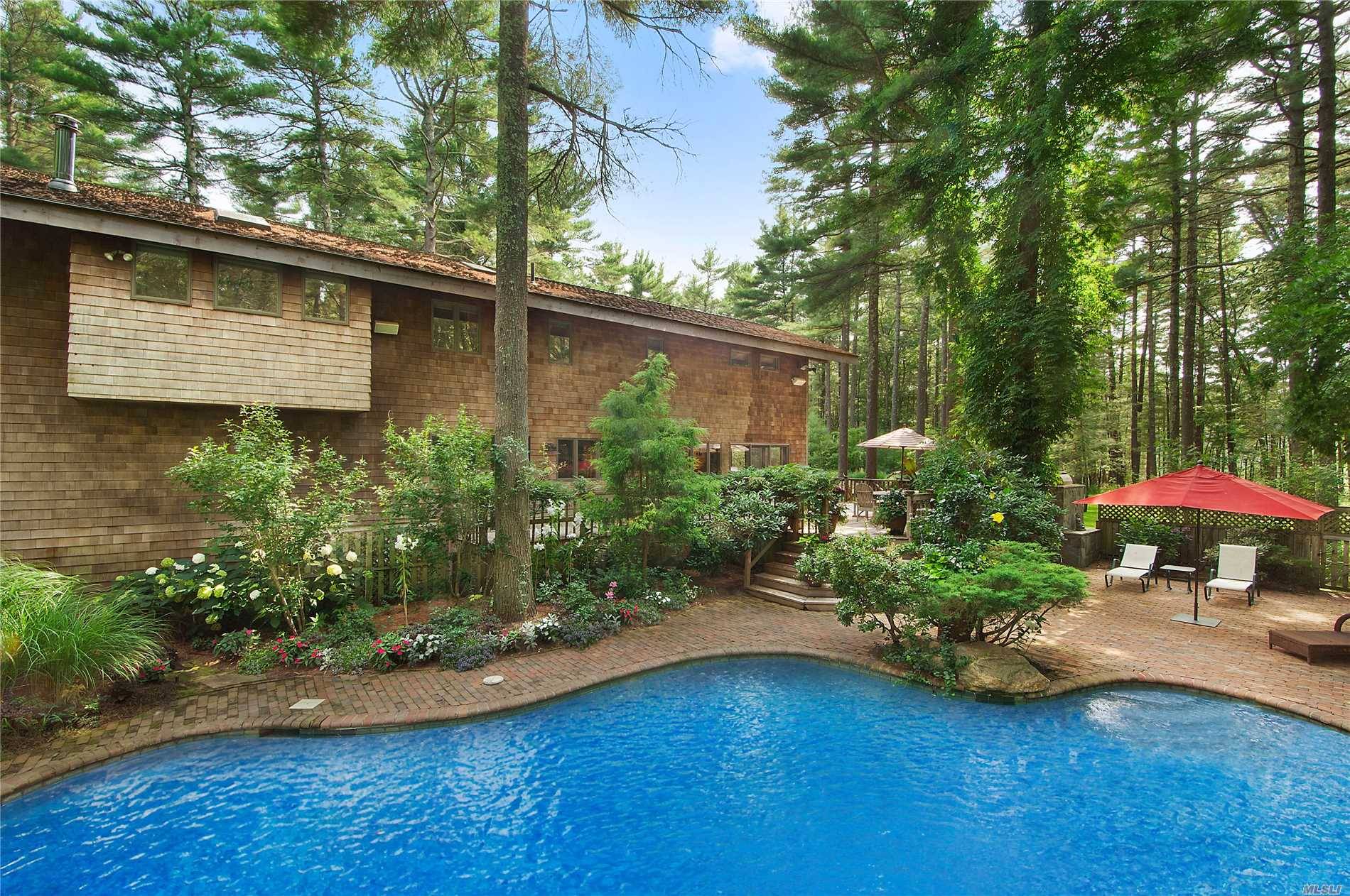 Located just outside East Hampton on 2 acres is this custom post and beam house.