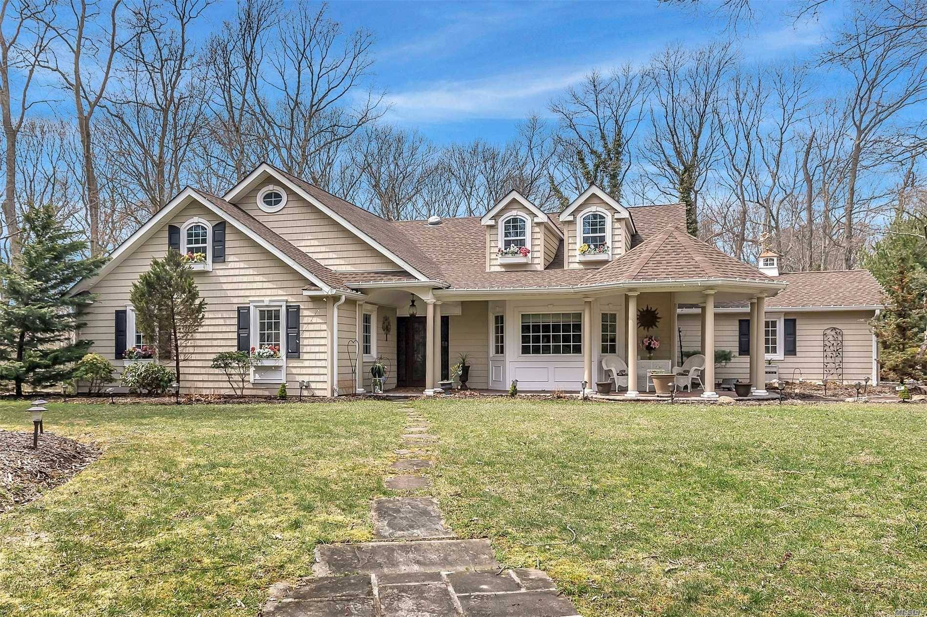 This spectacular Dix Hills Home in the Village Hill area over looks its picturesque surroundings.