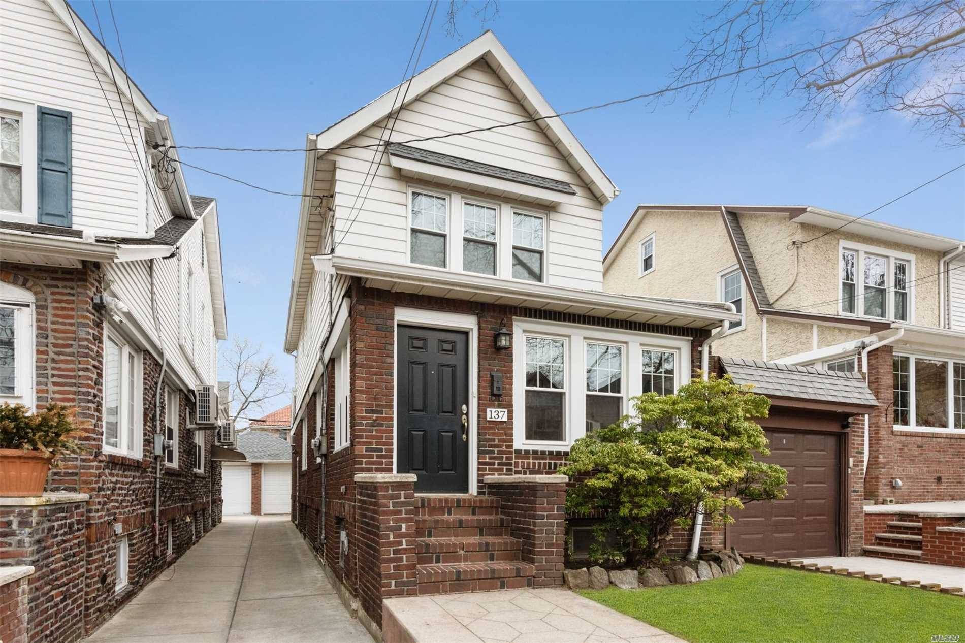 Beautiful Sun Filled, Renovated, Detached Colonial on Tree Lined Street in Desirable Section of Bay Ridge.