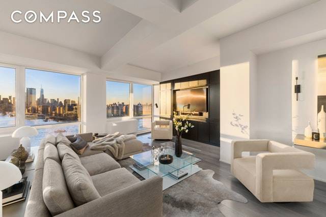 Perched high above the edge of the East River, this custom built penthouse offers sweeping water and Manhattan views that perfectly complement its exquisite interiors.