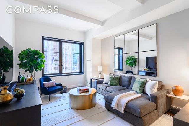 This oversized one bedroom spans 918 square feet and offers soaring 11' ceilings in a gracious one bedroom layout with one full bath and powder room.