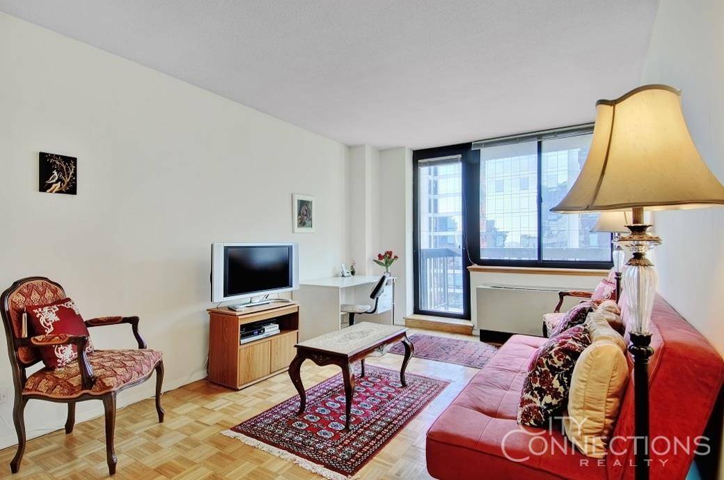 Rarely available high floor spacious 1 bedroom home with a private balcony in one of Midtown's most sought after condominiums !