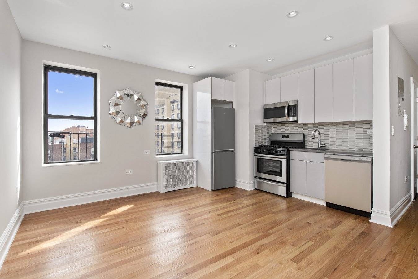 This modern, gut renovated one bedroom, one bath apartment features new oak hardwood floors, open kitchen with Quartz counter tops, stainless steel appliances and a glass tiled back splash, sparkling ...