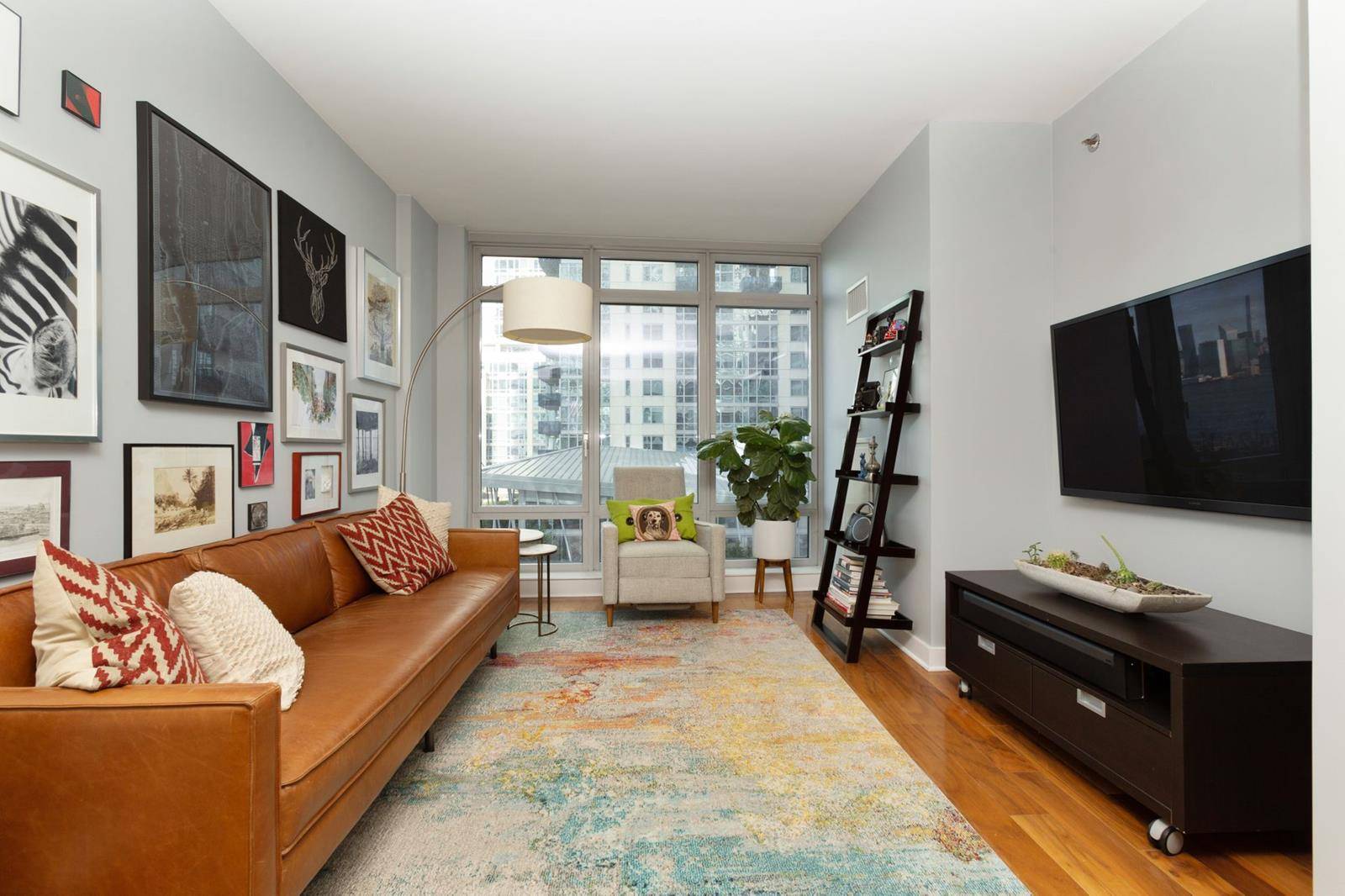 Back on the market ! Almost 1, 000 square feet that includes a home office and guest bathroom awaits on the edge of the East River.