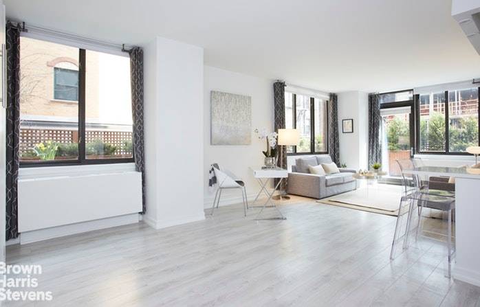 Modern, renovated studio with huge wraparound terrace on coveted 2nd floor of Nolita Place Condominium.