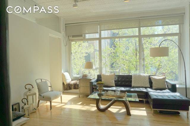 Fantastic, sunny classic loft in prime Chelsea Flatiron district, featuring 2 bedrooms and one and a half bathrooms.
