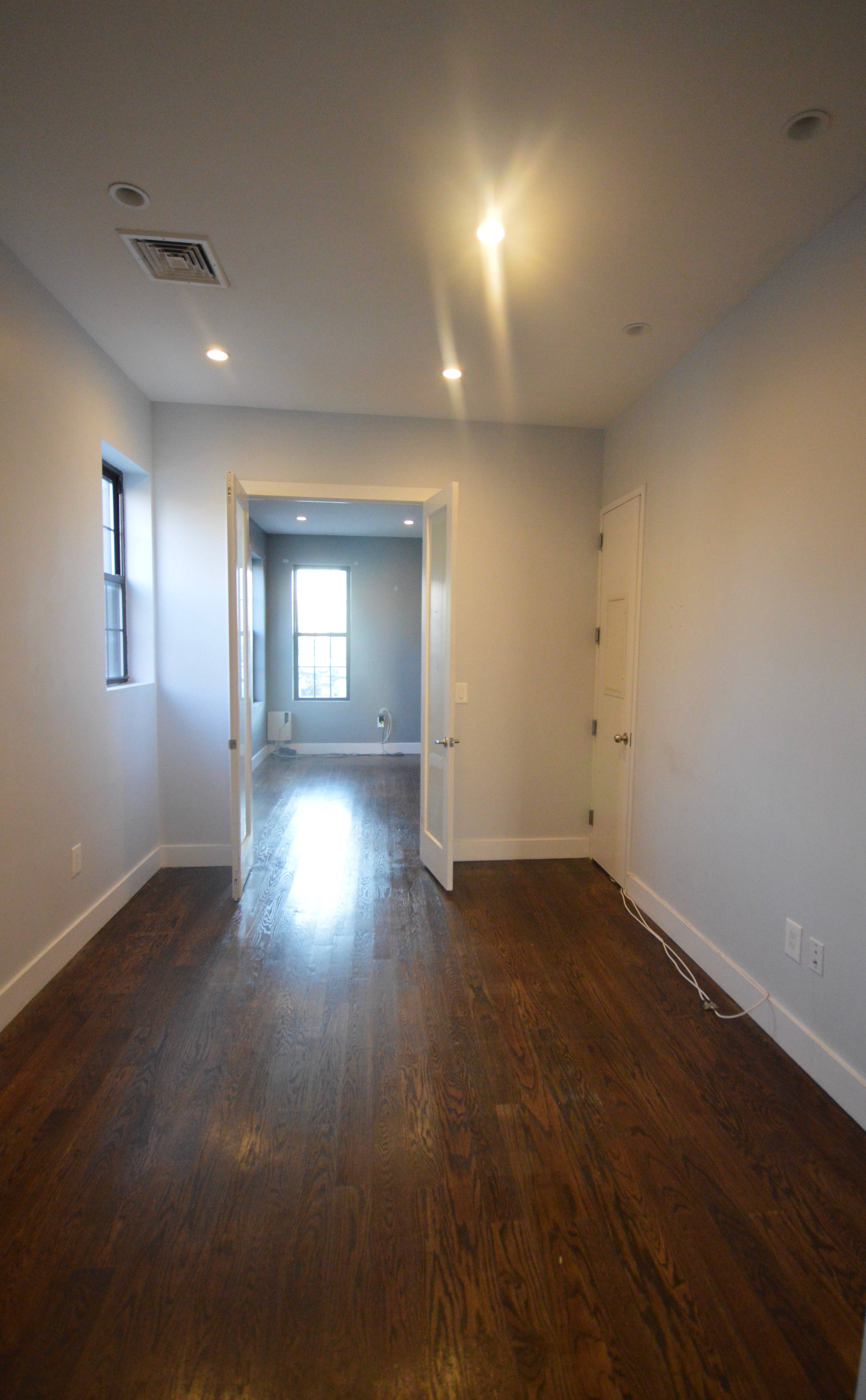 Spacious and modern 3 bedroom, one and a half bathroom apartment with high ceilings and hardwood floors throughout.