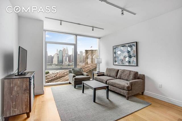 This coveted one bedroom offers the most striking views in Dumbo with floor to ceiling windows encasing the Brooklyn Bridge, Statue of Liberty, Governor's Island, Downtown Manhattan, and beloved Jane's ...