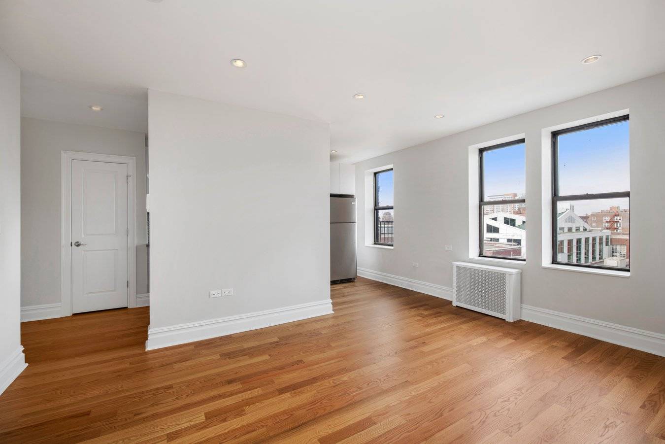 Modern, gut renovated one bedroom, one bath apartment featuring new oak hardwood floors, a large living room, separate kitchen with Quartz counter tops, abundant cabinet space, stainless steel appliances and ...
