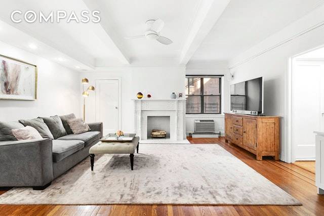 Live just one block from Central Park in this exquisite, pre war 2 bedroom with LOW maintenance.