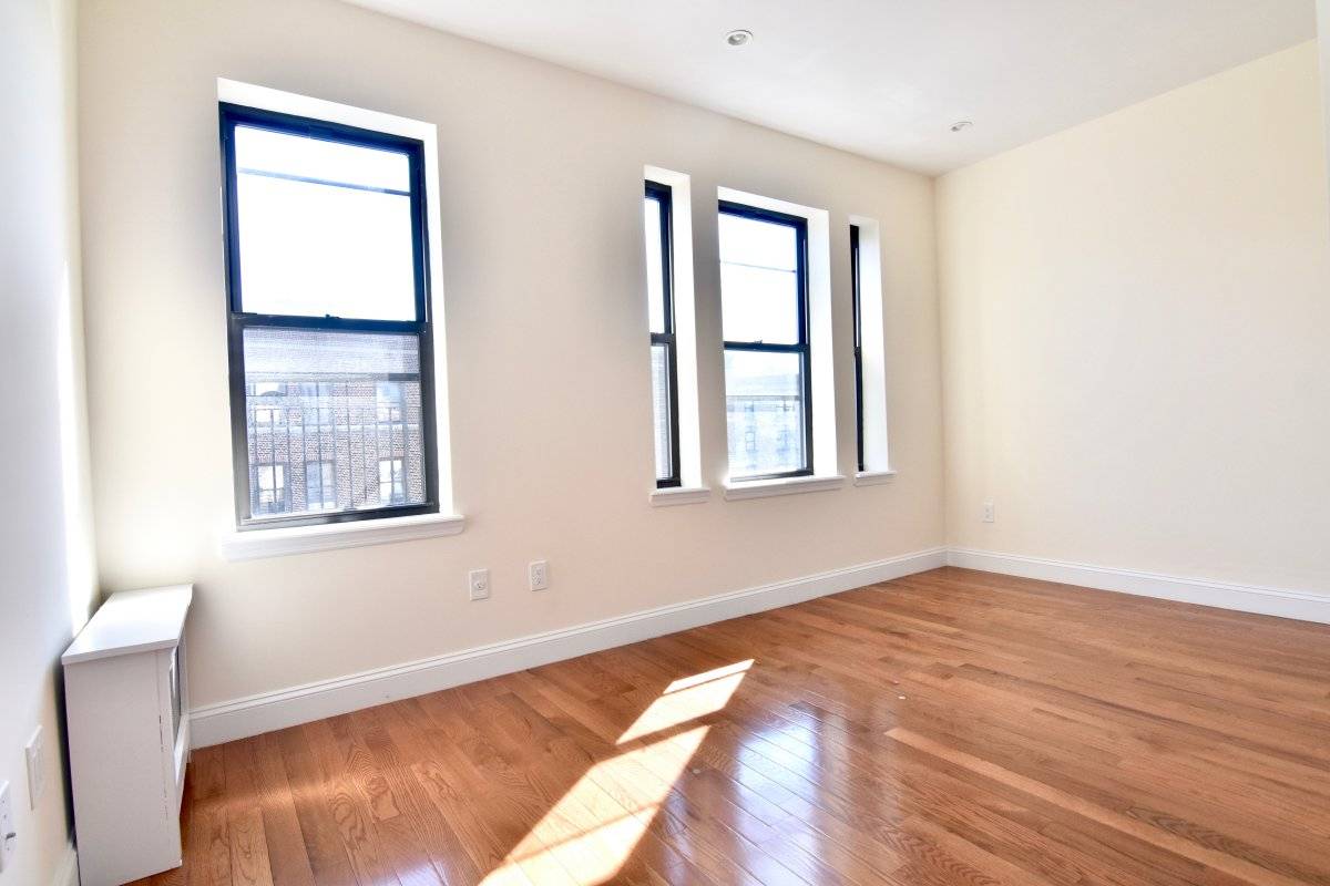 LOCATION 180th amp ; Pinehurst THE APARTMENT Incredible 3 Bedroom Exposed Brick Open Concept Kitchen Living Room Stainless Steel Appliances Incredible Natural Sunlight 3 Spacious Bedrooms Hardwood Floors Throughout Great ...