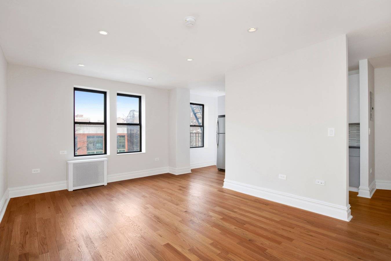 Modern, gut renovated one bedroom, one bath apartment featuring new oak hardwood floors, a large living room, separate kitchen with Quartz counter tops, abundant cabinet space, stainless steel appliances and ...