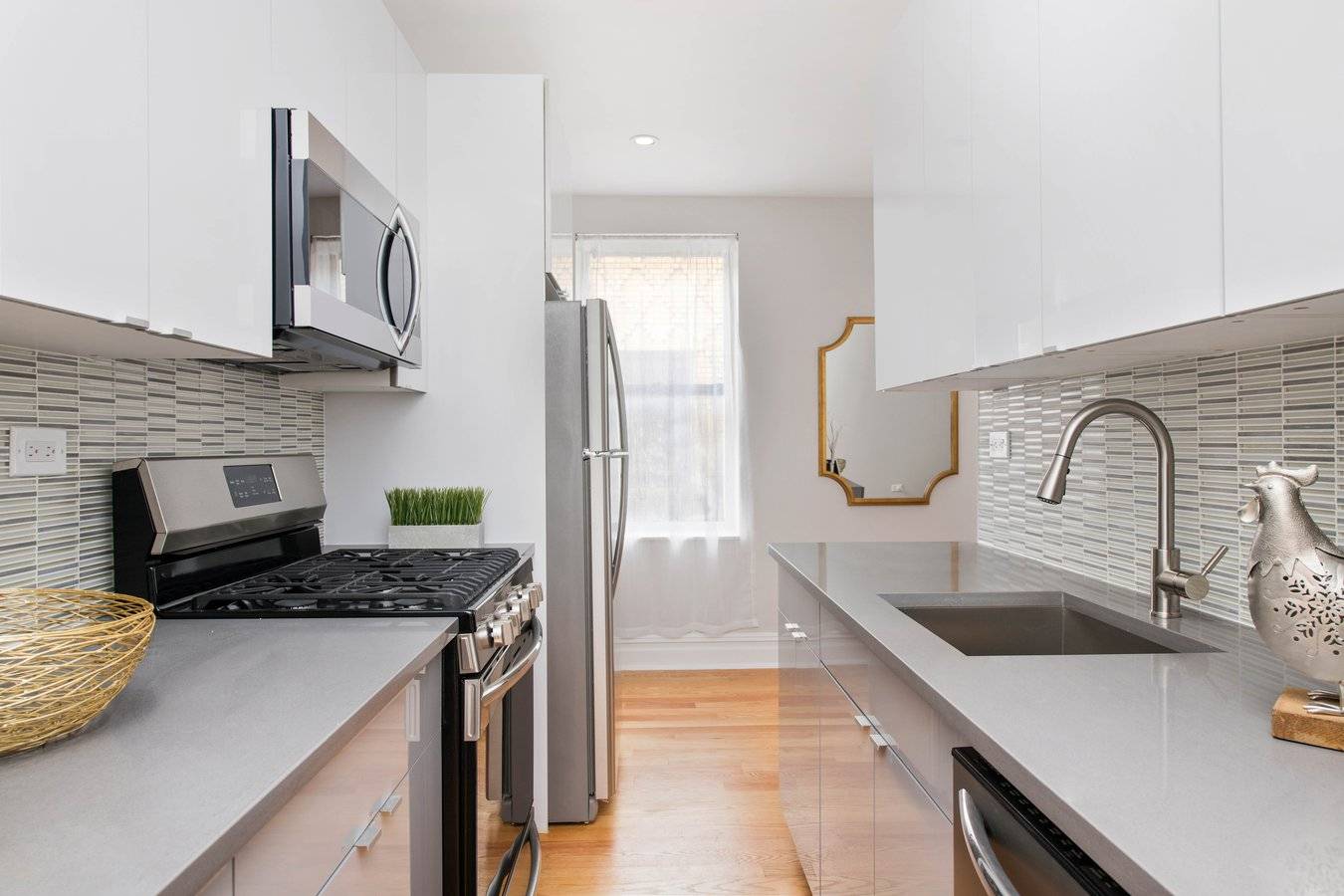 Modern, gut renovated one bedroom, one bath apartment featuring new oak hardwood floors, a spacious living room, separate kitchen with Quartz counter tops, abundant cabinet space, stainless steel appliances and ...