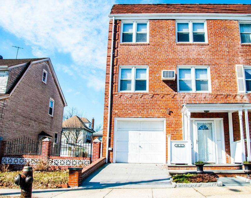 80 12 165th St Is a Beautiful Two Family Brick Semi Detached Townhouse located on quiet residential street In Hillcrest.