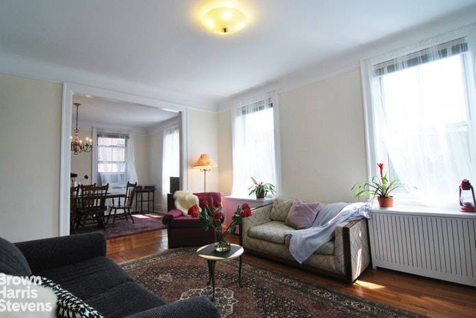 Spacious and bright is this top floor 1 bedroom with formal dining room with large south and east facing windows !