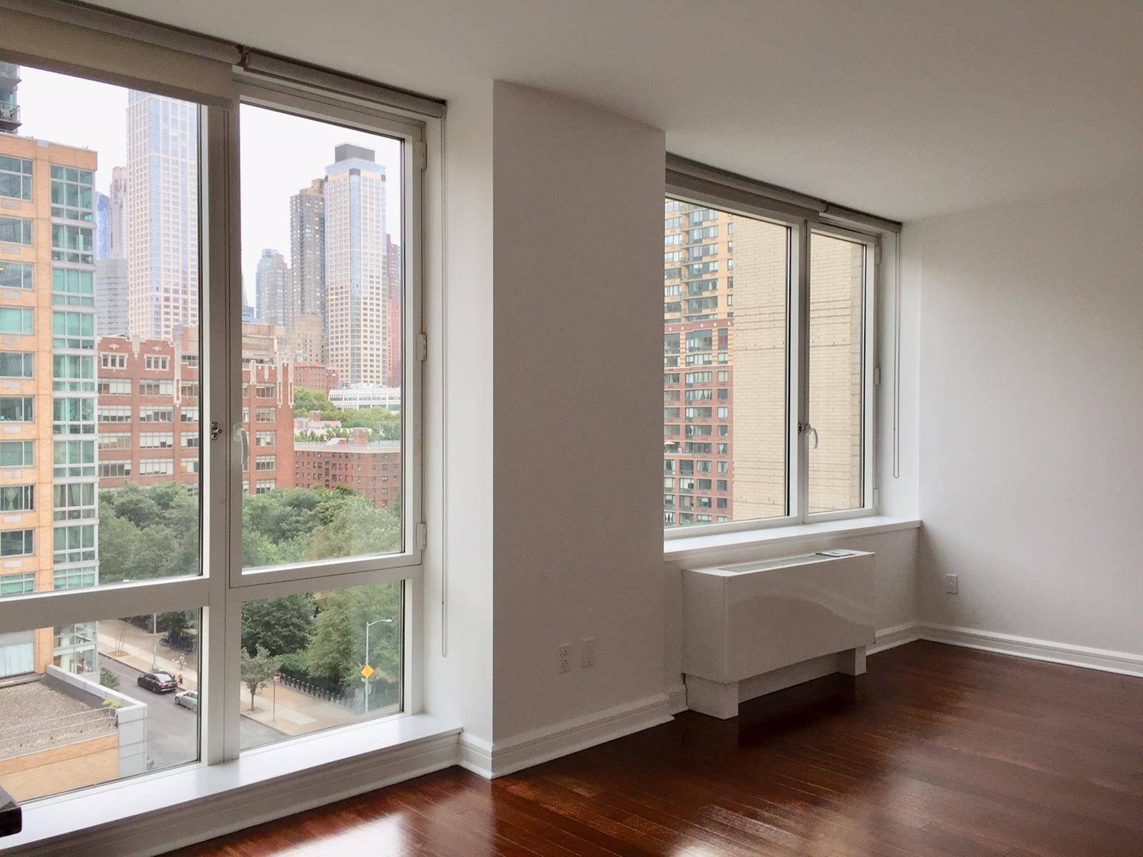 Move in to this beautiful, spacious one bedroom apartment featuring floor to ceiling windows and hardwood floors throughout.