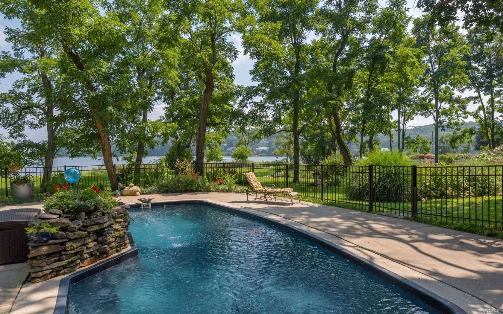 Wonderful private 168' waterfront Mill Neck Bay home with beautiful views of the bridge.