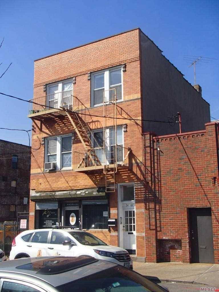 Brick Mixed Used Building Consisting Of 2 Residential Apartments And A Street Level Store Front Space.
