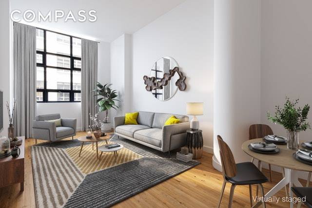 Extra Large, loft like, 885 sqft one bedroom condo with soaring 13 ceilings in One Brooklyn Bridge Park.
