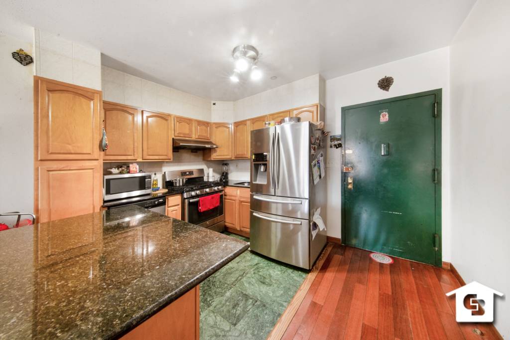 Your new home is a gorgeous three bedroom, two bathroom Bay Ridge condo.