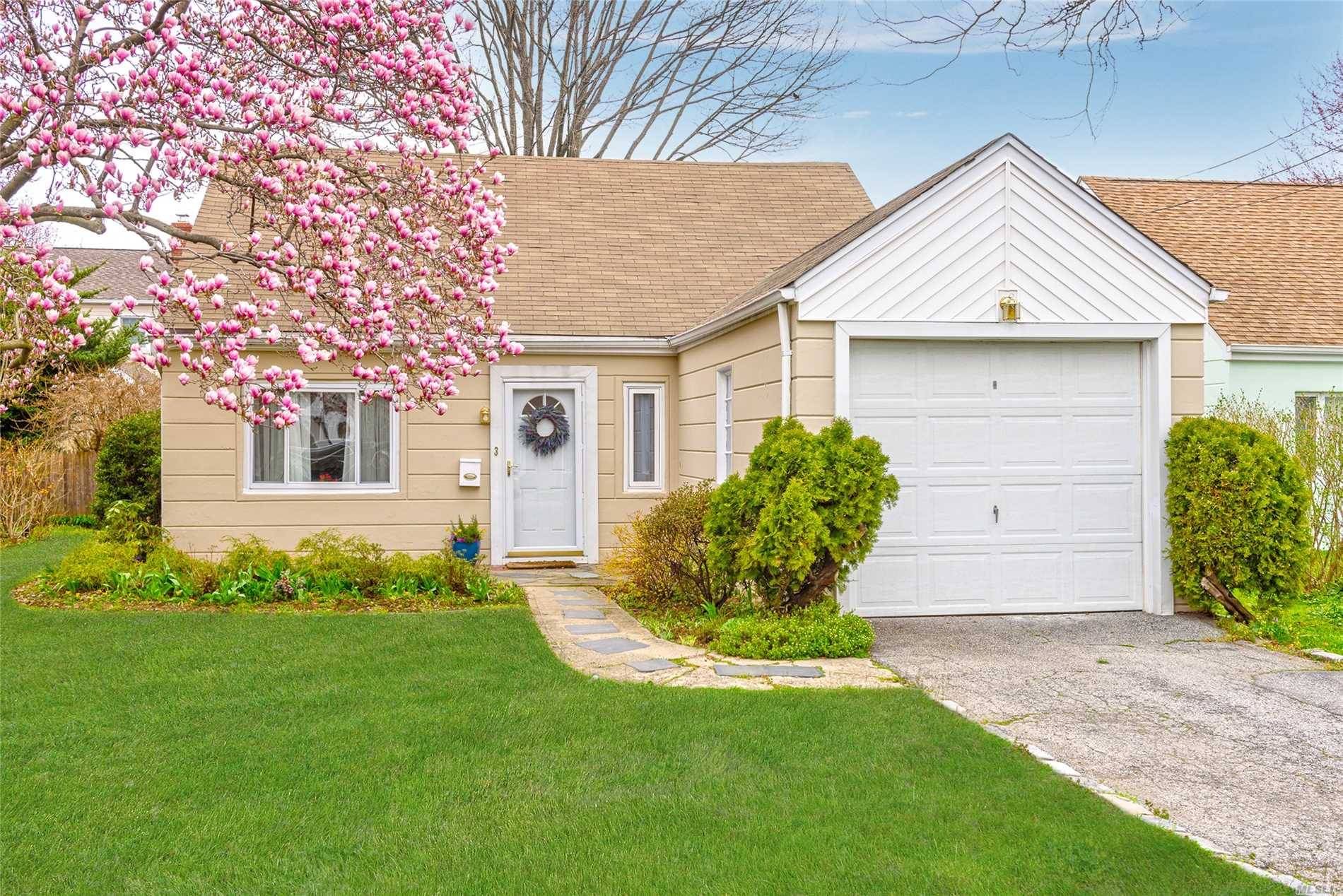 Charming four bedroom two bath cape in the heart of Manhasset Isle.