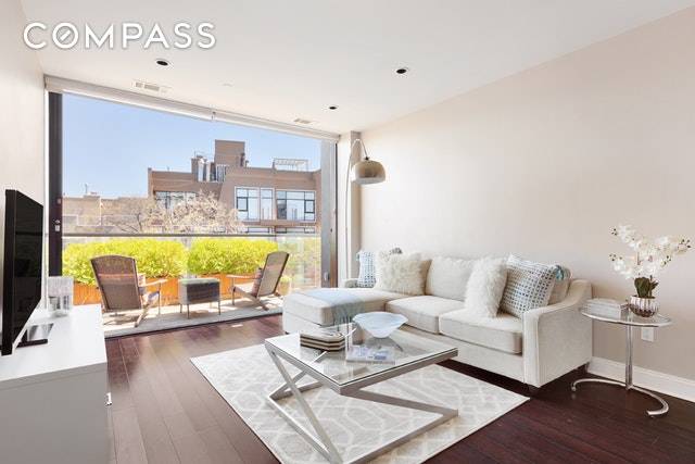 Stunning floor to ceiling sliding glass doors open your wall up in this gorgeous 1 bed, 1 bath condo in Williamsburg.