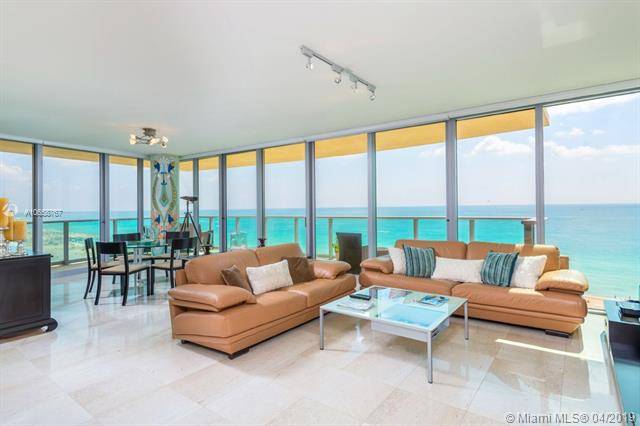 Enjoy breathtaking direct ocean views from this stunning corner residence at prestigious Il Villaggio Condominium