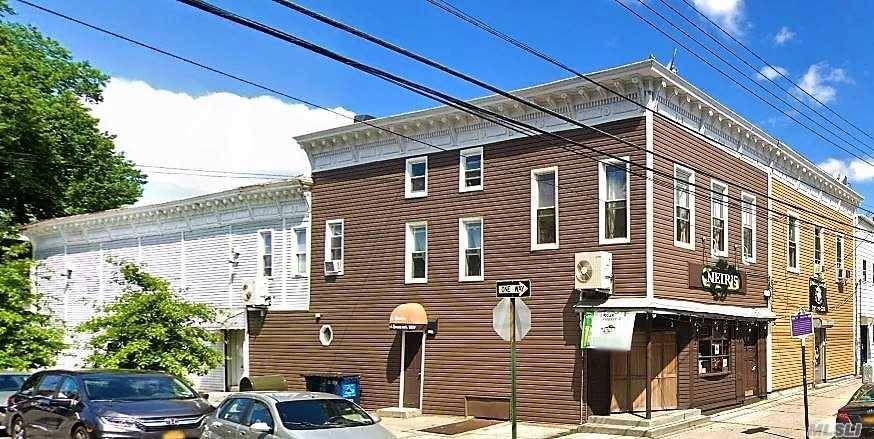Mixed Use Property In The Heart Of Woodhaven Consists Of Five Commercial Units And Two Residential Apartments.