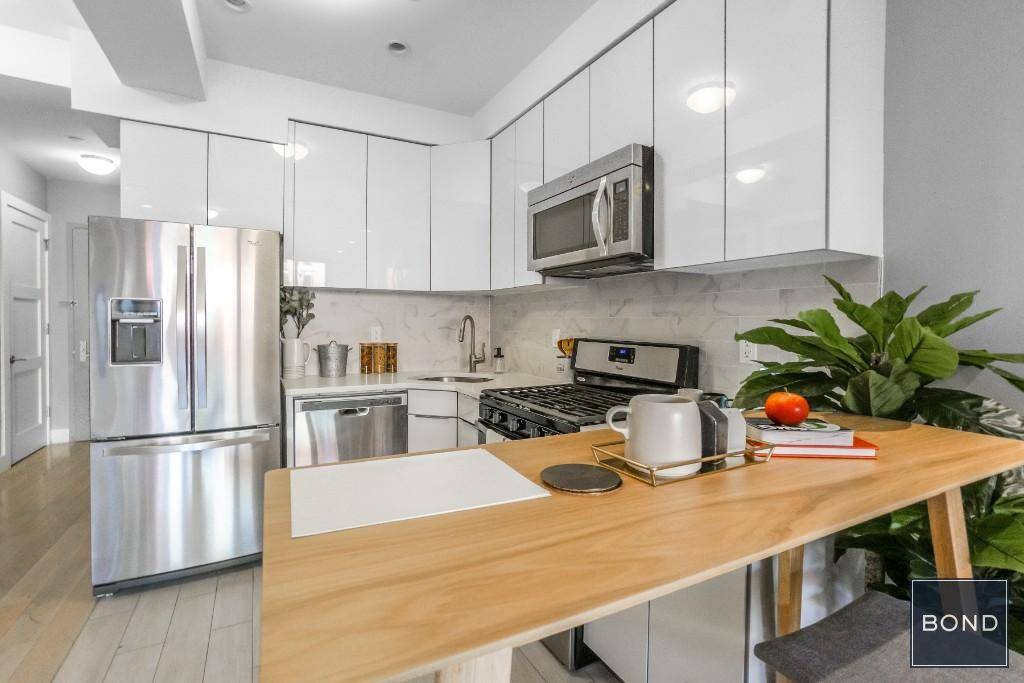 East Villlage 2 bedroom below 1 million dollars w d in unitOpen kitchens feature Scandinavian minimalist style cabinetry with solid countertops, imported porcelain floor tiles and Carrara Marble backsplashes.