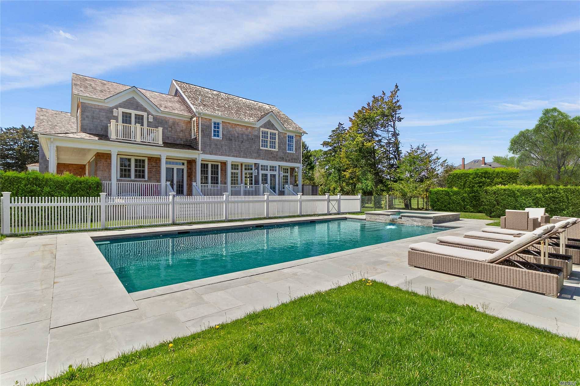 Located in the heart of the Westhampton Beach village estate section, this beautifully crafted Hamptons cedar shake beach house stands tall.
