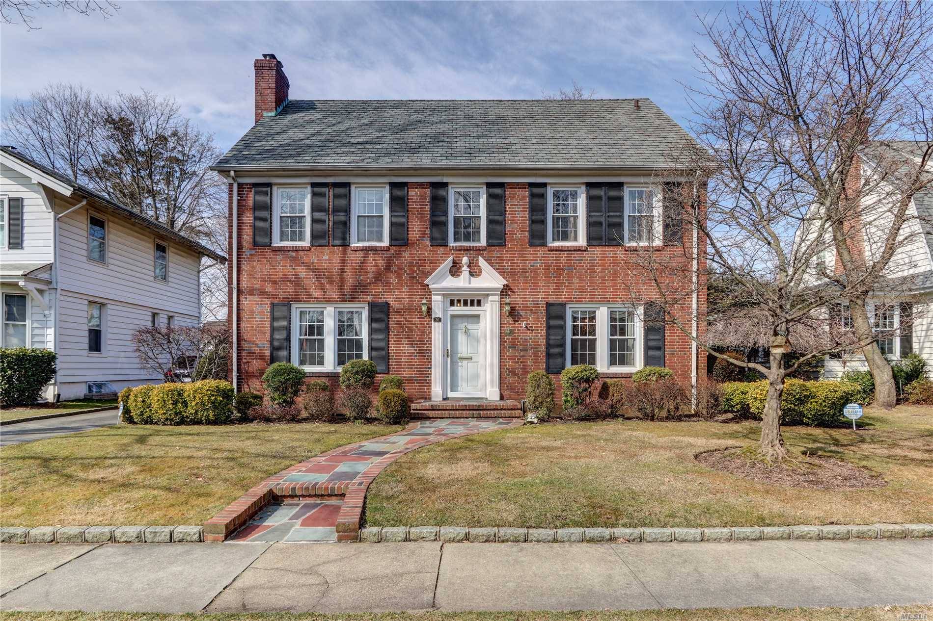 Perfectly situated mid block brick center hall colonial with oversized bedrooms, including master with suite.