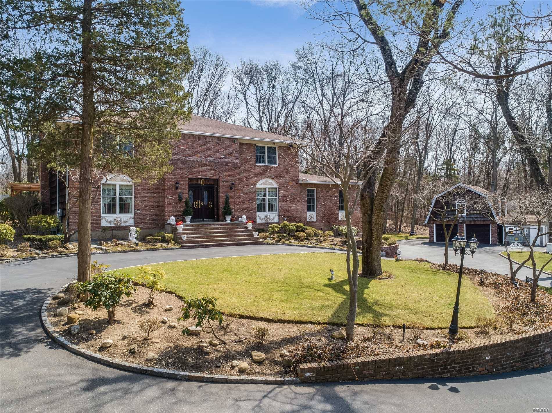 A Magnificent Driveway Leads You To a Trad Colonial, Beautifully Situated on 2 Acres In Upper Brookville.
