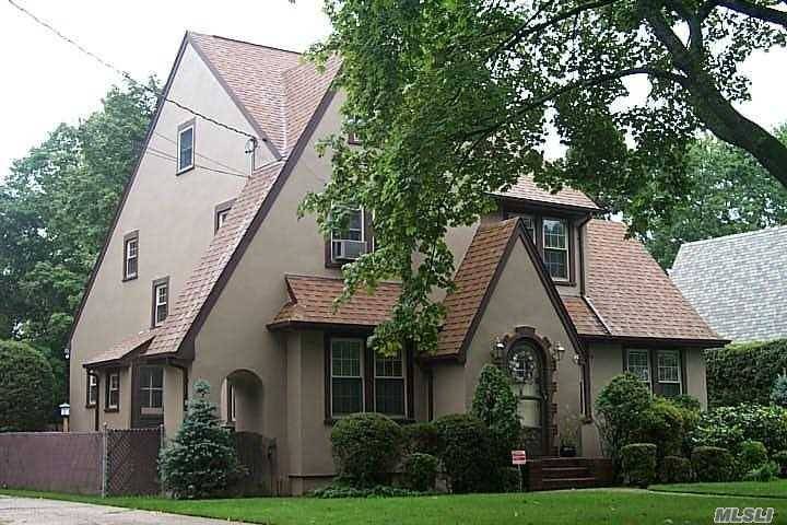 Tudor Style Home on Oversize Parklike Property.