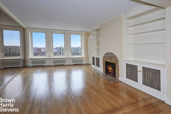 All the windows of this exceptionally grand five room pre war home offer open views of the East River and beyond.
