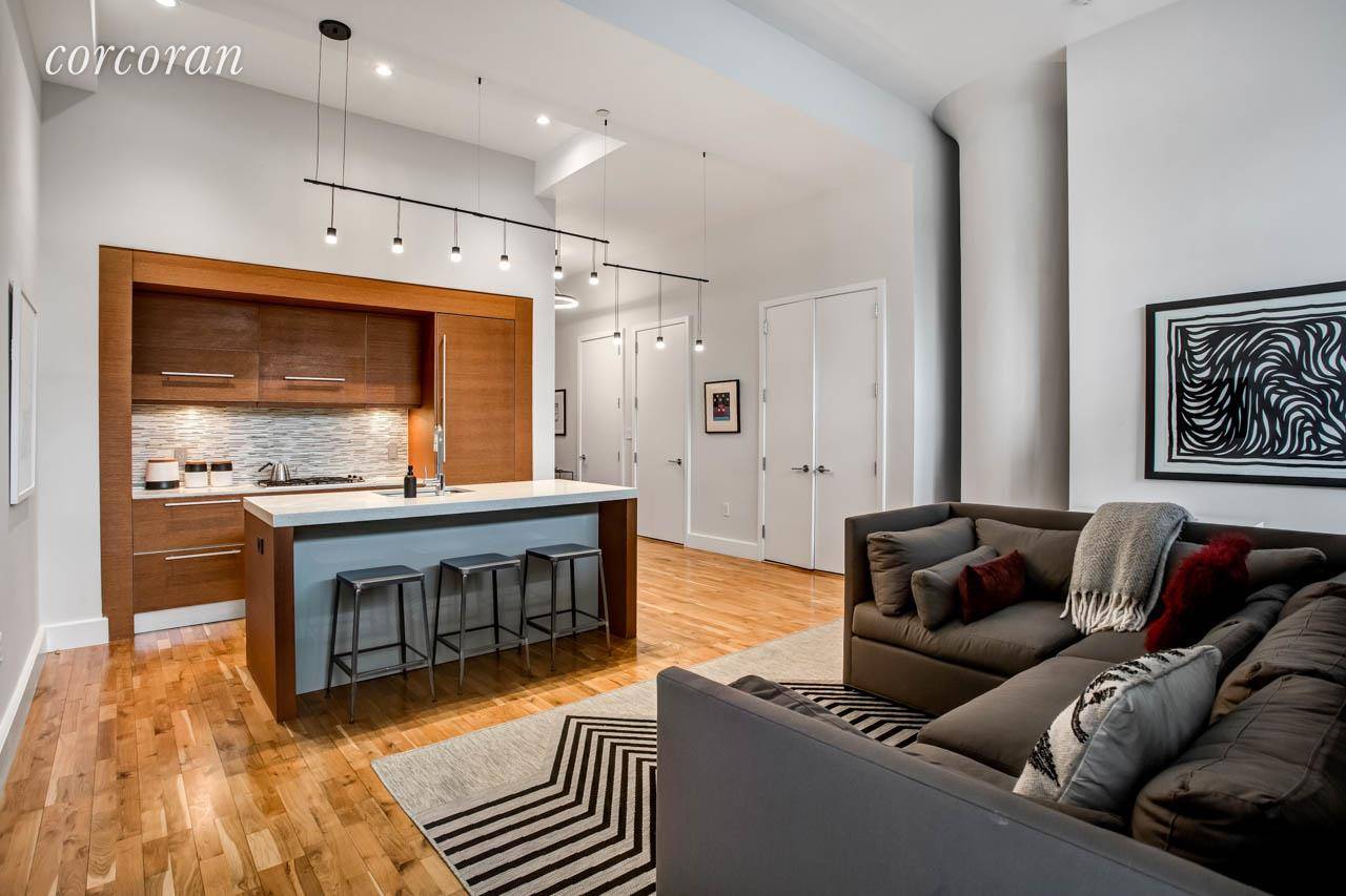 Wonderful light and 13' high ceilings are the first thing you notice when you enter this 843 sq ft well designed loft.