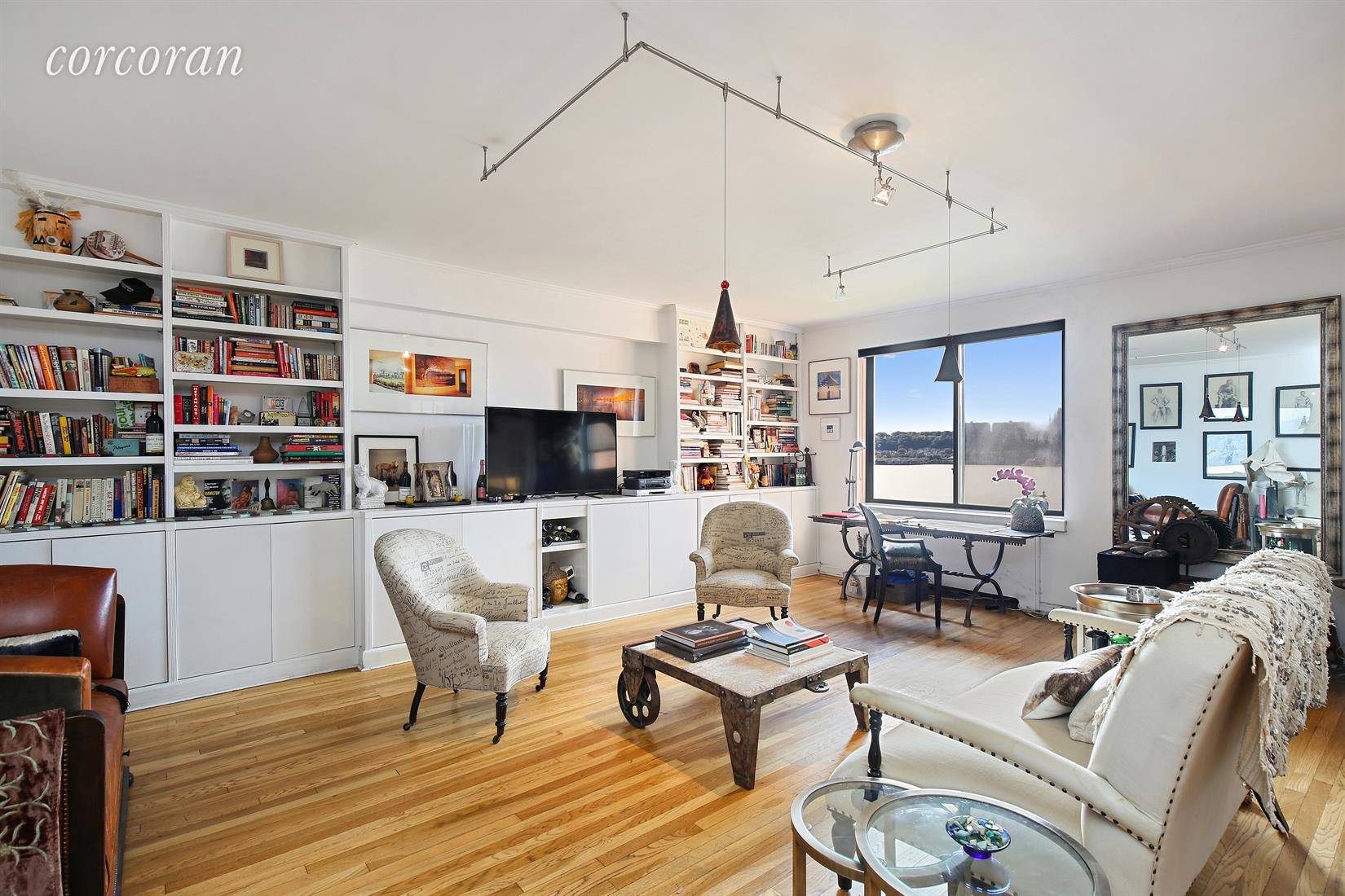 EXCITING OFFERING ON RIVERSIDE DRIVE Luxuriate in space in this smartly designed one of a kind home with 4 exposures, gorgeous natural light and unobstructed views of the Hudson River.