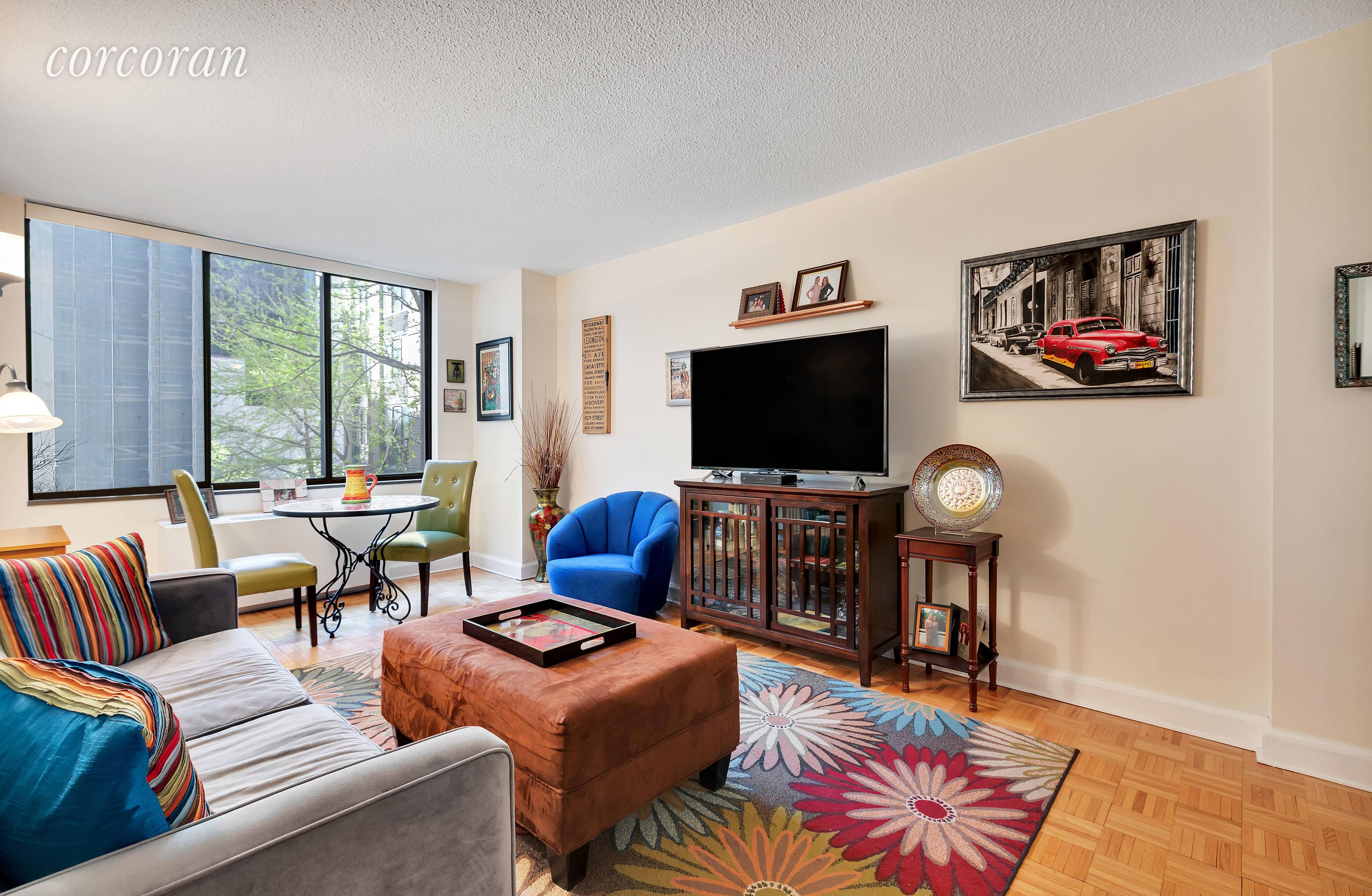 Light, bright and spacious 1 bedroom apartment setback from the street overlooking the treetop views of the building's courtyard in The Madison Green Condominium.