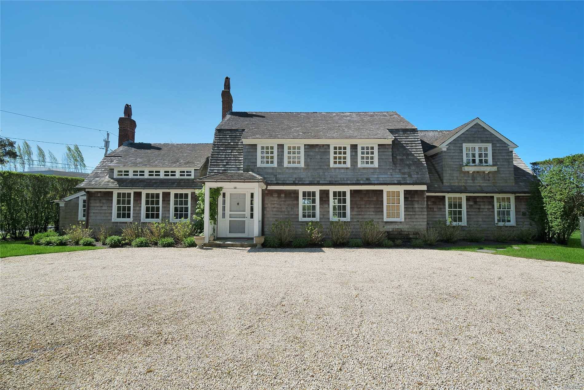 Contemporized home from yesteryear in South Quogue offered for sale since its complete stylish renovation.