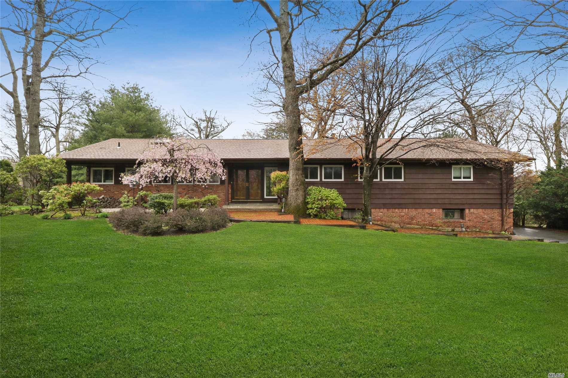 Taxes being grieved. Beautifully appointed Ft Salonga Mid Century Modern Ranch on lush acre.