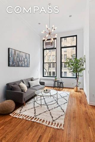 Located on a quiet block in Greenwich Village, this amazing south facing loft boasts massive windows generating a superb influx of natural light.