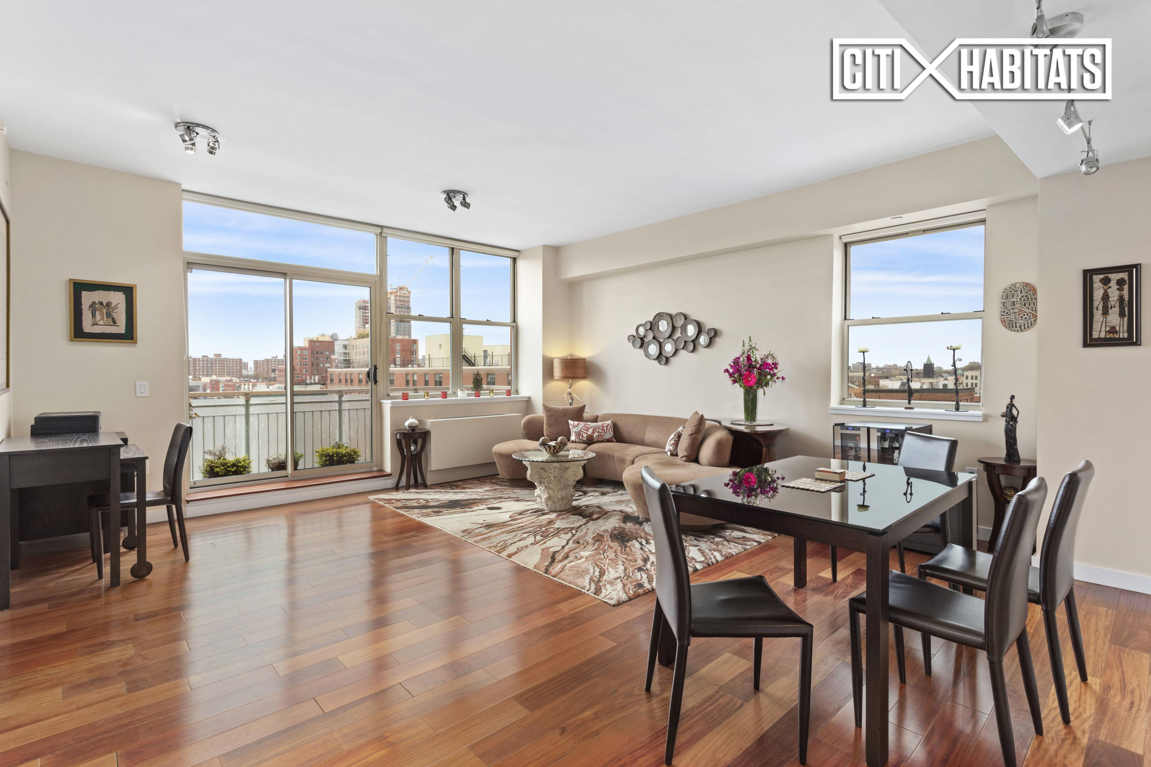 Penthouse 8a, freshly painted a soft white, is a 1410 sf, 3 bedroom, 2 bath home featuring mahogany hard wood floors, 9' ceilings and oversize windows, creating an open, airy ...