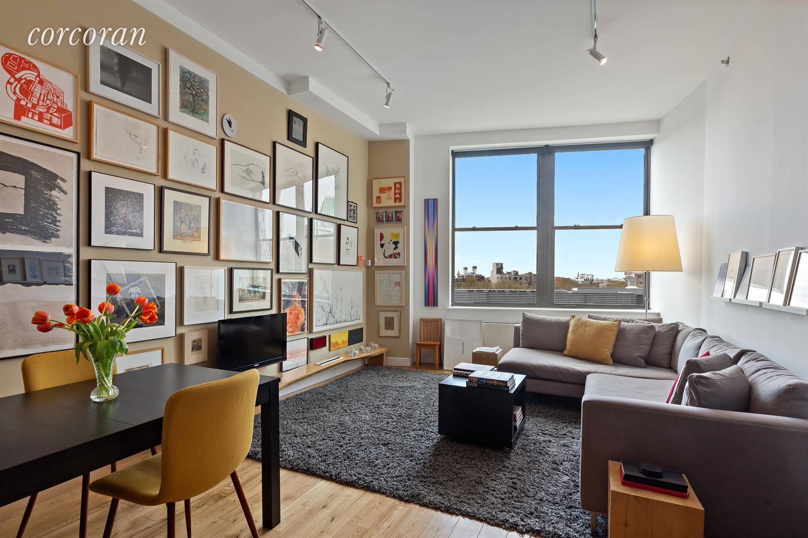 Measuring over 720 square feet, with 11' ceilings throughout and a separate sleeping area complete with custom floor to ceiling sliding doors, this apartment feels like a spacious one bedroom, ...
